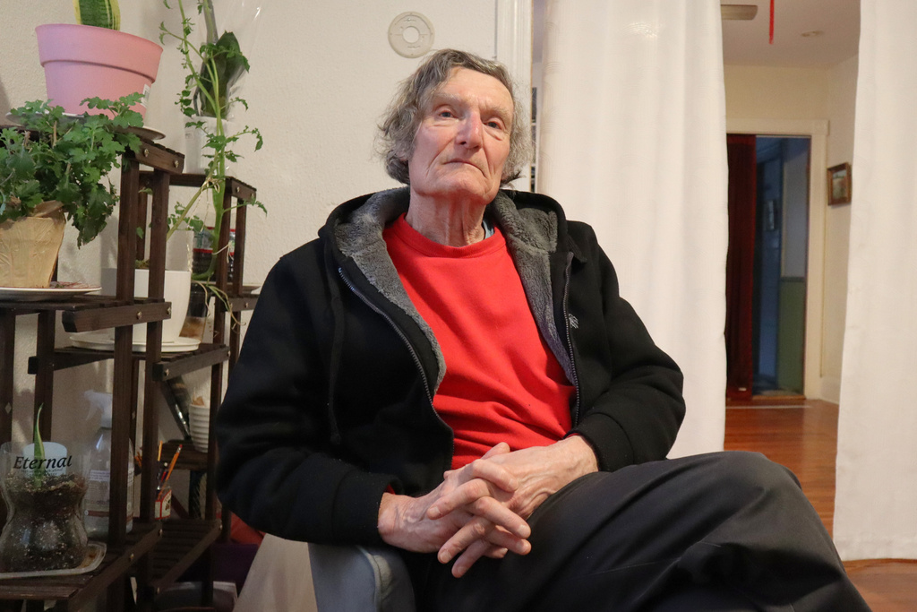 Claude Leboeuf, a clergy abuse survivor and advocate, sits for a portrait at his home in Providence, R.I., Thursday, March 5, 2026, after a report by the Rhode Island attorney general detailed decades of abuse within the Catholic Diocese of Providence. (AP Photo/Leah Willingham)