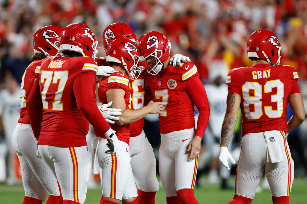 Kansas City Chiefs place kicker Harrison Butker (7) is congratulated by teammates after making a field goal to defeat the Indianapolis Colts in overtime of an NFL football game Sunday, Sept. 20, 2026, in Kansas City, Mo. during overtime of an NFL football game Sunday, Sept. 20, 2026, in Kansas City, Mo. (AP Photo/Colin E. Braley)
