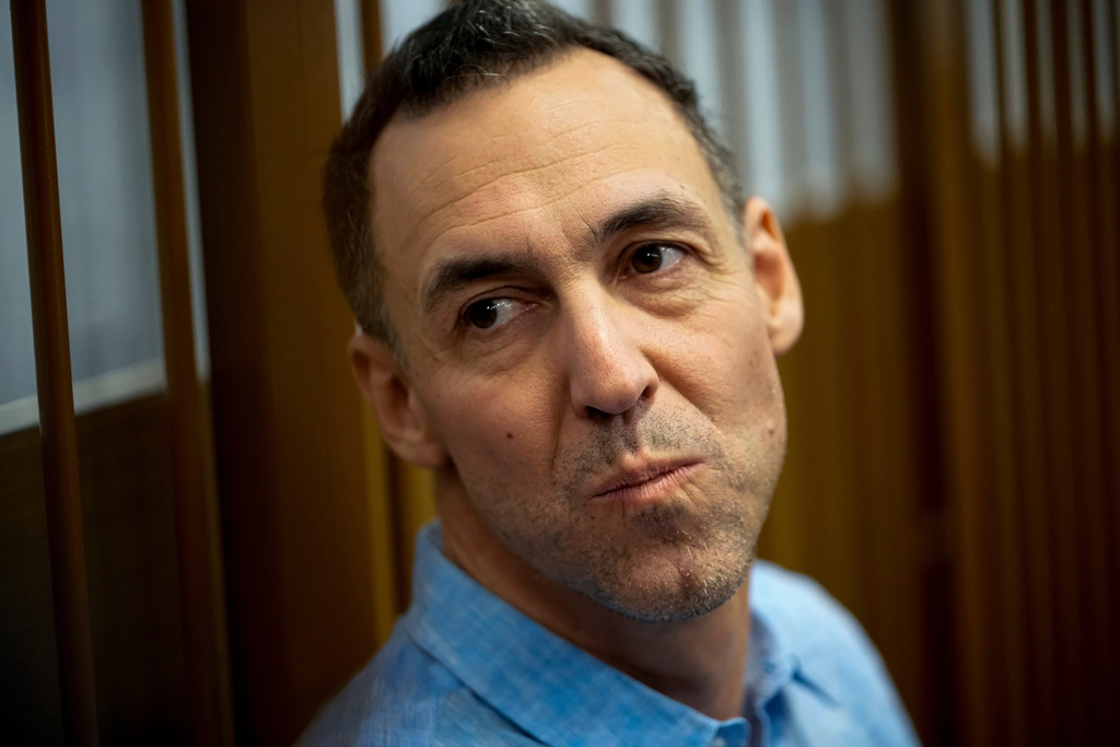 FILE - French citizen Laurent Vinatier sits in a cage prior to a court session at the Zamoskvoretsky District Court in Moscow, Oct. 14, 2024. (AP Photo/Pavel Bednyakov, File)