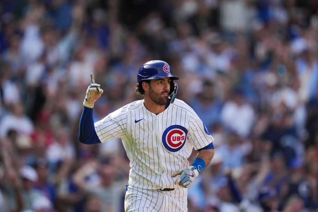 Chicago Cubs' Dansby Swanson reacts after driving in the game-winning run in the 10th inning of a baseball game against the Philadelphia Phillies, Thursday, April 23, 2026, in Chicago. (AP Photo/Erin Hooley)