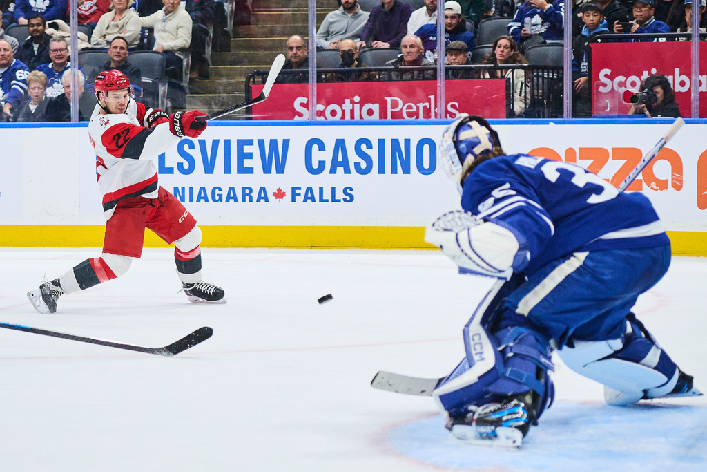 Carolina Hurricanes' Logan Stankoven (22) scores the game winning goal against the Toronto Maple Leafs during the third period of an NHL hockey game in Toronto, on Sunday, Nov. 9, 2025. (Sammy Kogan/The Canadian Press via AP)