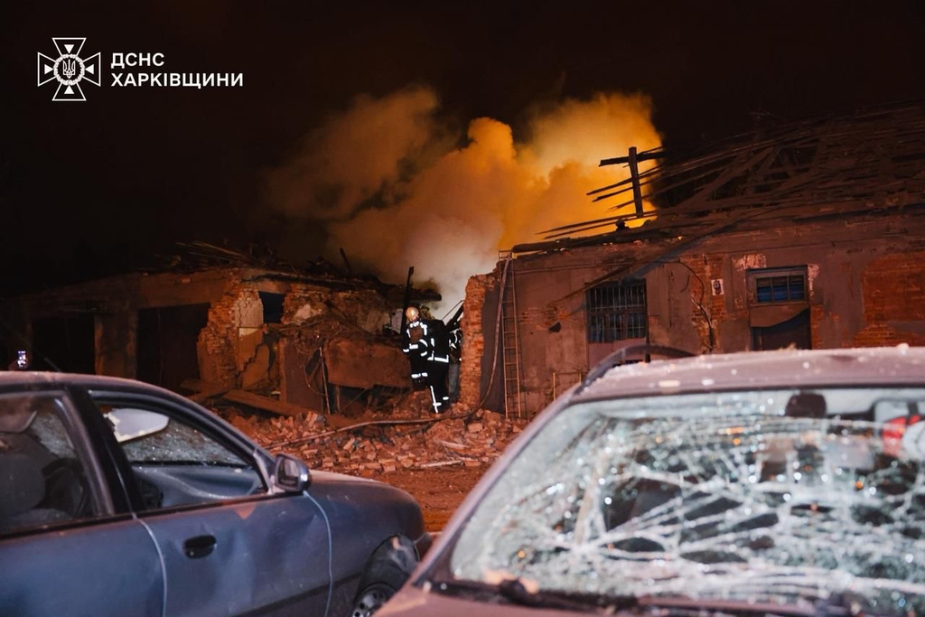 In this photo provided by the Ukrainian Emergency Services on Tuesday, Oct. 14, 2025, rescue workers put out a fire of a hospital damaged by a Russian strike in Kharkiv, Ukraine. (Ukrainian Emergency Service via AP)