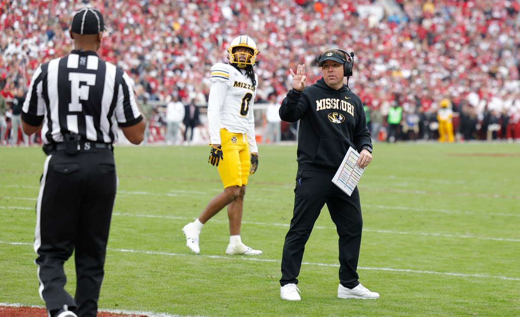 Missouri head coach Eli Drinkwitz calls for a time out against Oklahoma during the first half of an NCAA college football game Saturday, Nov. 22, 2025, in Norman, Okla. (AP Photo/Alonzo Adams)