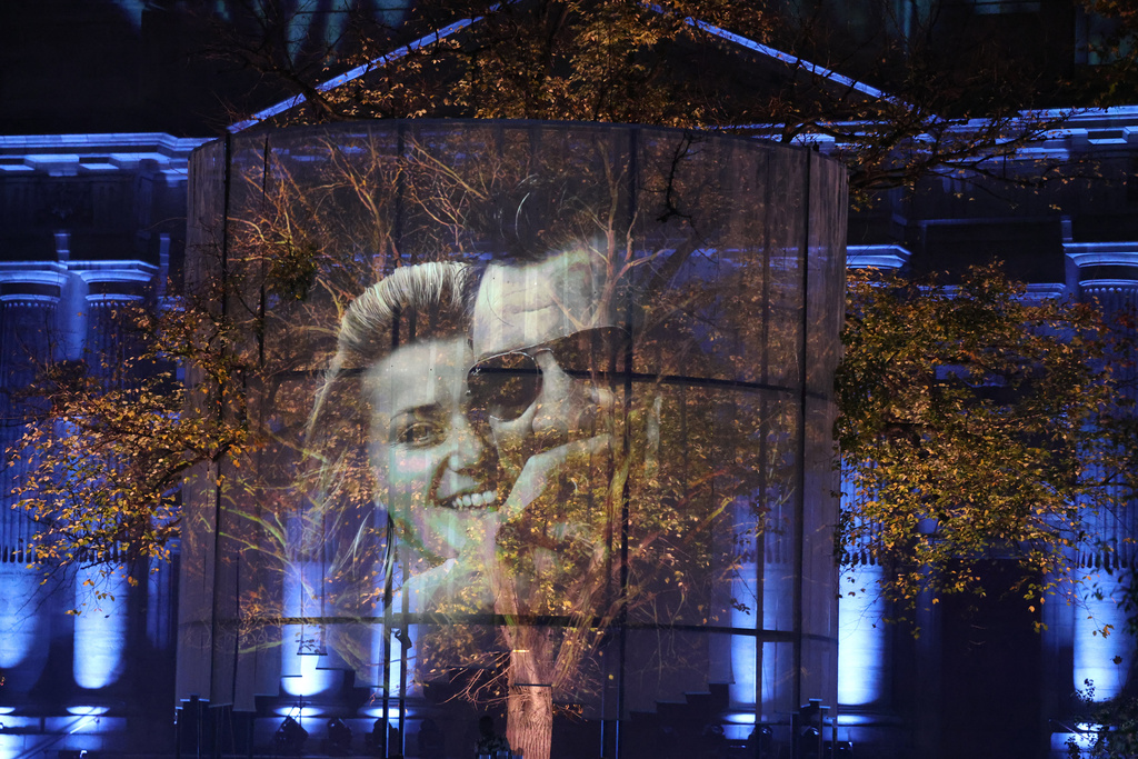 Photos of victims are projected during a sound and light show at the "Jardin du 13 novembre 2015" inaugurated Thursday Nov. 13, 2025 in Paris as part of ceremonies marking the 10th anniversary of terrorist attacks that killed 132 people and injured hundreds. (Ludovic Marin, Pool photo via AP)