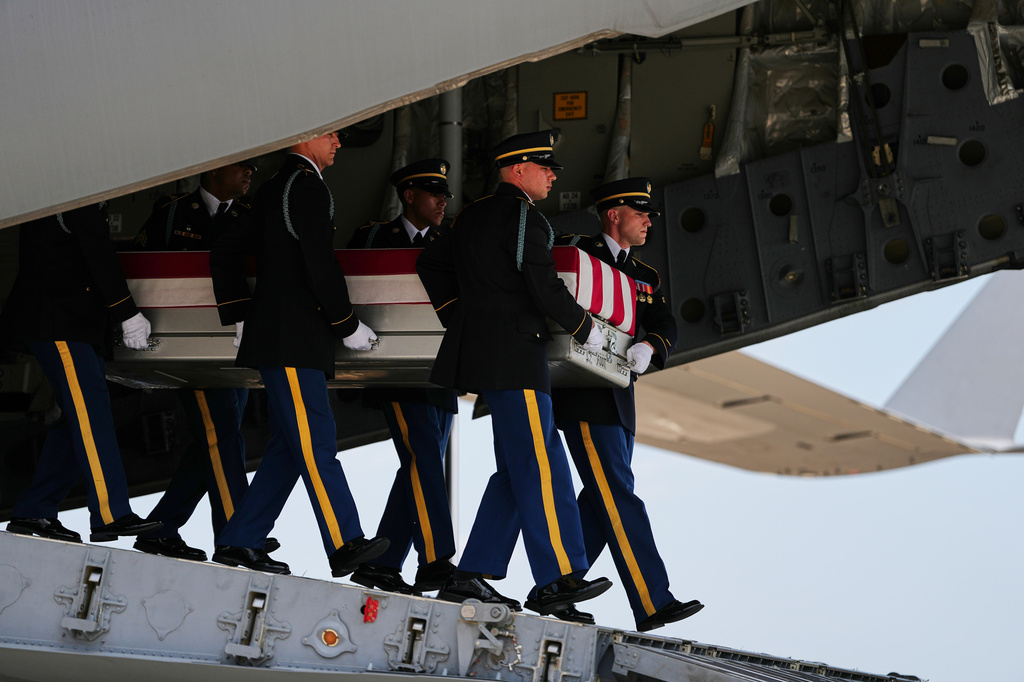 A U.S. Army carry team moves a transfer case containing the remains of 1st Lt. Tyler James Feehan of Ewa Beach, Hawaii, Wednesday, July 22, 2026, at Dover Air Force Base, Del. (AP Photo/Matt Rourke)