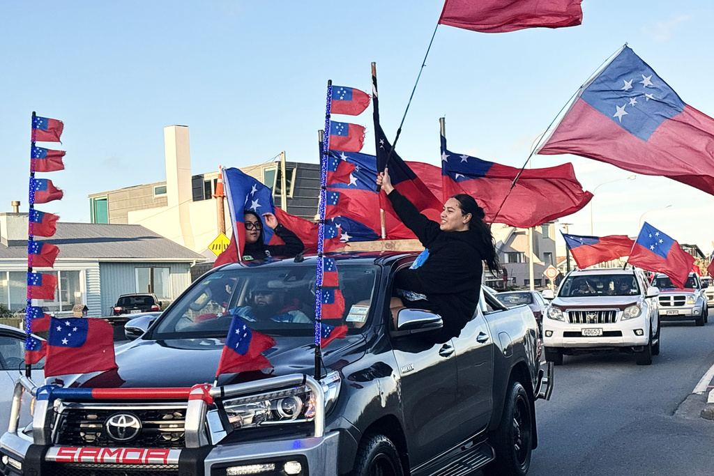 Toa Sāmoa fans react as they drive in a convoy through the streets of Lyall Bay in Wellington, New Zealand, Saturday, Nov. 8, 2025 ahead of the Pacific Cup rugby league final against New Zealand in Sydney, Australia, Sunday Nov. 9. (AP Photo/Charlotte Graham-McLay)