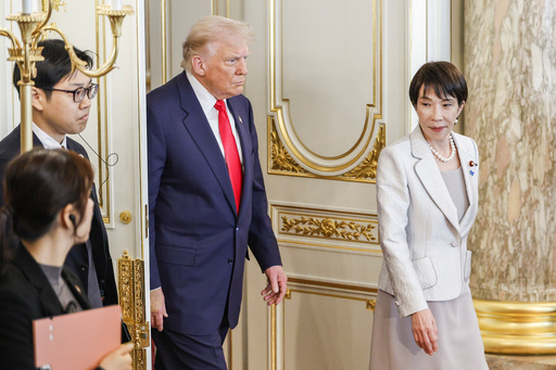 U.S. President Donald Trump, center, and Japan's Prime Minister Sanae Takaichi, right, arrive for the Japan-US summit meeting at Akasaka Palace State Guest House in Tokyo, Japan, Tuesday, Oct. 28, 2025. (Franck Robichon/Pool Photo via AP) U.S. President Donald Trump, center, and Japan's Prime Minister Sanae Takaichi, right, arrive for the Japan-US summit meeting at Akasaka Palace State Guest House in Tokyo, Japan, Tuesday, Oct. 28, 2025. (Franck Robichon/Pool Photo via AP)