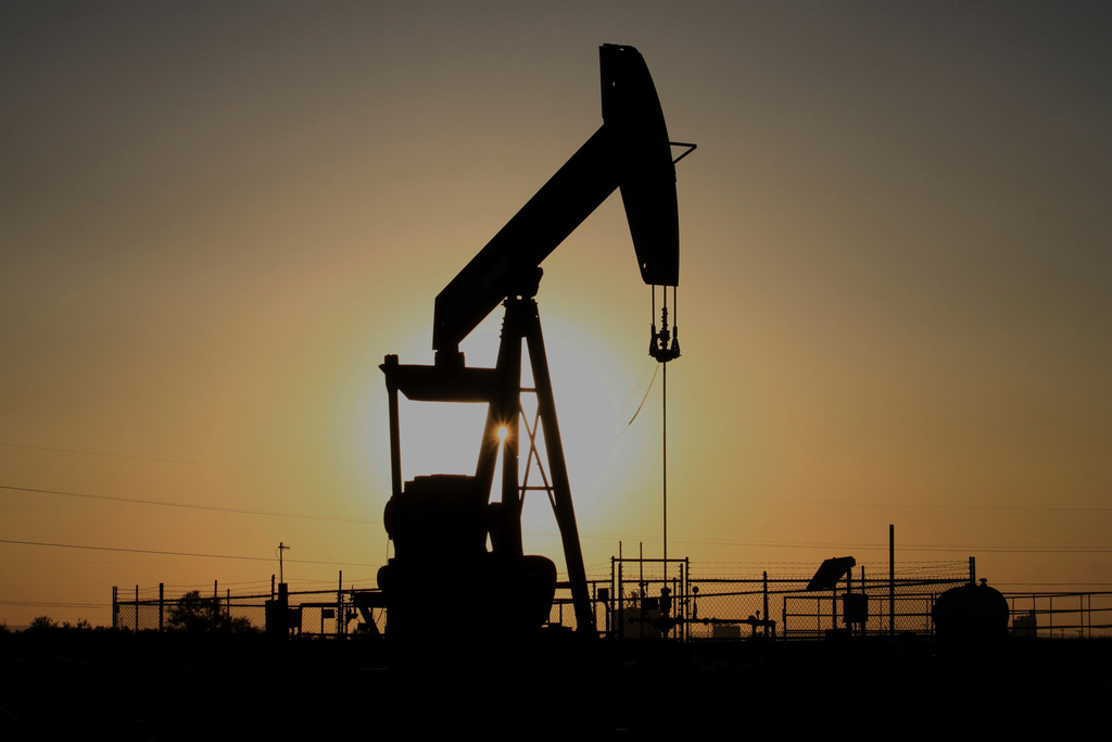 FILE - A pump jack operates at sunset in the Permian Basin near Loving, N.M., May 20, 2025. (AP Photo/Susan Montoya Bryan, File)