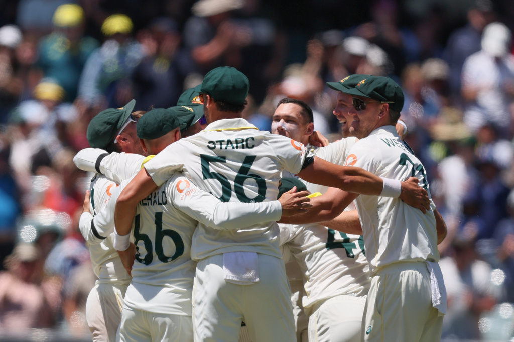 Australia's players celebrate after winning the third Ashes Test against England in Adelaide, Australia, Sunday, Dec. 21, 2025. (AP Photo/James Elsby)