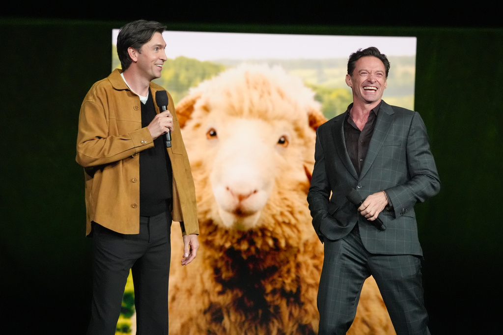 Cast members Nicholas Braun, left, and Hugh Jackman of the upcoming film "The Sheep Detectives" speak during the Amazon MGM Studios presentation at CinemaCon on Wednesday, April 15, 2026, at Caesars Palace in Las Vegas. (AP Photo/Chris Pizzello)