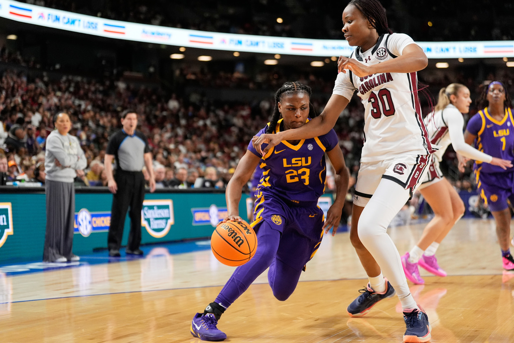 LSU guard Milaysia Fulwiley drives to the basket past South Carolina forward Maryam Dauda during the first half of an NCAA college basketball game in the semifinals of the Southeastern Conference tournament, Saturday, March 7, 2026, in Greenville, S.C. (AP Photo/Chris Carlson)