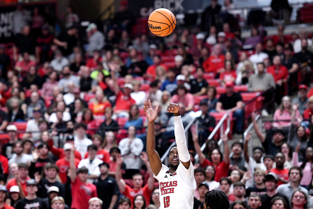 Texas Tech guard Donovan Atwell (12) shoots a three-pointer during the first half in an NCAA college basketball game against Lindenwood, Tuesday, Nov. 4, 2025, in Lubbock, Texas. (AP Photo/Annie Rice)