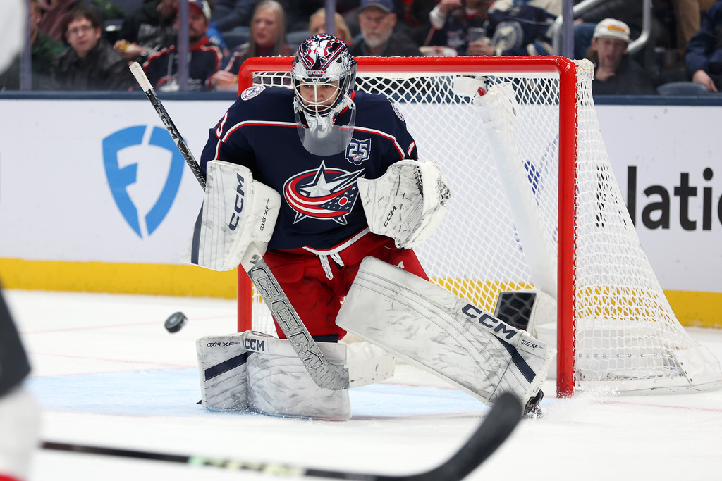 Columbus Blue Jackets goaltender Jet Greaves (73) saves the puck during the second period of an NHL hockey game against the Vegas Golden Knights Saturday, Dec. 13, 2025, in Columbus, Ohio. (AP Photo/Joe Maiorana)