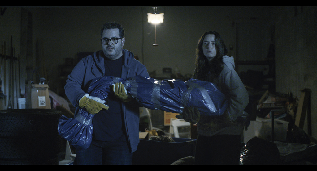 This image released by Republic Pictures shows Josh Gad, left, and Kaya Scodelario in a scene from "Adulthood." (Albert Camicioli/Republic Pictures via AP)