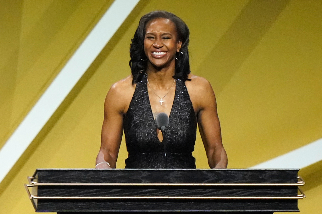 FILE - Tamika Catchings smiles as she speaks while being enshrined into the Basketball Hall of Fame, May 15, 2021, in Uncasville, Conn. (AP Photo/Kathy Willens, File)