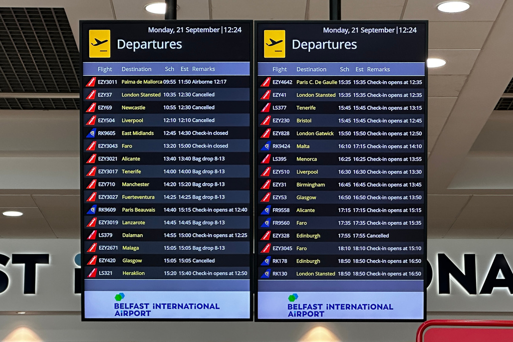 A departures board at Belfast International Airport, Co Antrim, following disruption to flights due to a "technical issue" at an air traffic control centre in Scotland, Monday Sept. 21, 2026. (Liam McBurney/PA via AP)