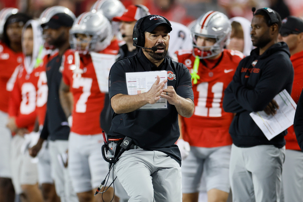 Ohio State head coach Ryan Day, center, calls for a timeout during the second half of an NCAA college football game against Maryland, Saturday, Oct. 10, 2026, in Columbus, Ohio. (AP Photo/Jay LaPrete)
