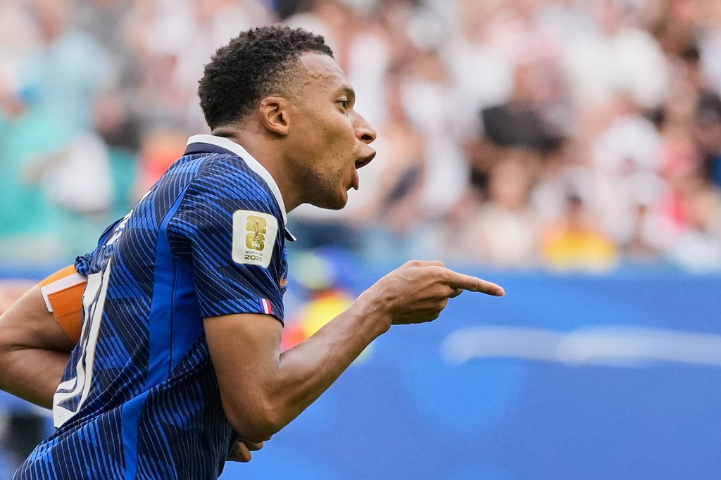 France's Kylian Mbappe (10) celebrates scoring his side's third goal during the World Cup third-place playoff soccer match between France and England in Miami Gardens, Fla., Saturday, July 18, 2026. (AP Photo/Rebecca Blackwell)