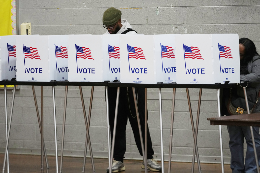 Voters fill out their ballot Tuesday, Nov. 4, 2025, in Detroit. (AP Photo/Paul Sancya)