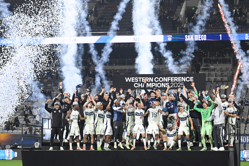 Vancouver Whitecaps players celebrate after winning the MLS Western Conference final soccer match against San Diego FC, Saturday, Nov. 29, 2025, in San Diego. (AP Photo/Denis Poroy)