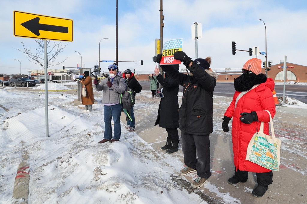 Protesters gather outside an event venue, as Vice President J.D. Vance visits Minneapolis, Thursday, Jan. 22, 2026. (AP Photo/Adam Bettcher)