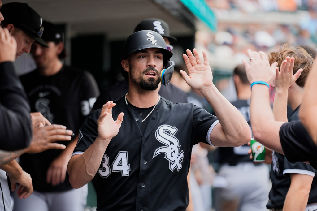 Chicago White Sox's Randal Grichuk (34) celebrates scoring against the Detroit Tigers during the seventh inning of a baseball game Saturday, Aug. 15, 2026, in Detroit. (AP Photo/Paul Sancya)