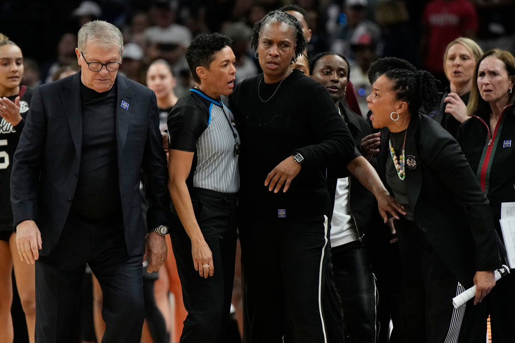 South Carolina head coach Dawn Staley, right, yells at UConn head coach Geno Auriemma, left, after a woman's NCAA college basketball tournament semifinal game at the Final Four, Friday, April 3, 2026, in Phoenix. (AP Photo/Ross D. Franklin)