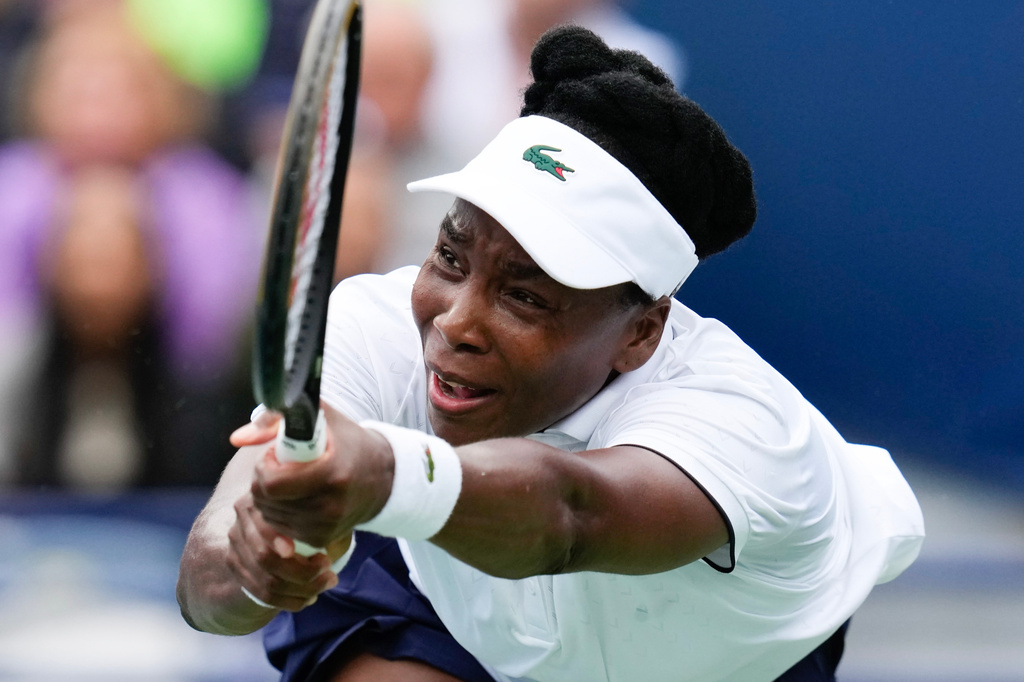 Venus Williams plays a return against Kamilla Rakhimova during the National Bank Open tennis tournament in Toronto, Sunday, Aug. 2, 2026. (Chris Young/The Canadian Press via AP)