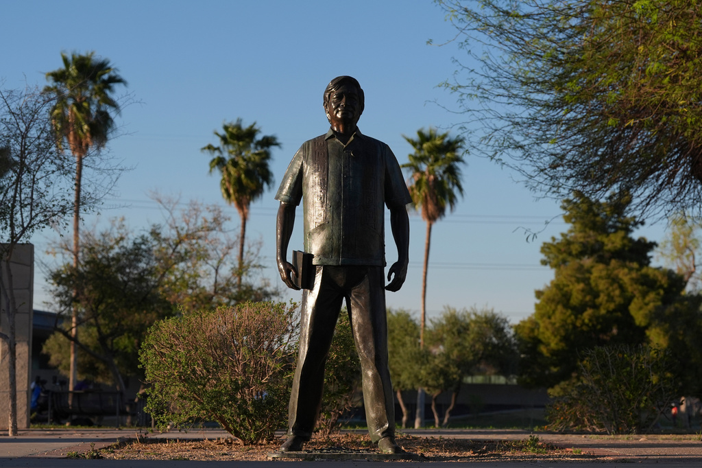 FILE - A statute of César Chavez stands in the middle of a plaza at Cesar Chavez Park, honoring the United Farm Workers union founder, March 18, 2026, in Laveen, Ariz. (AP Photo/Ross D. Franklin, File)