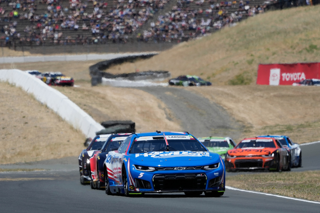 Kyle Larson, foreground, drives in front of cars during a NASCAR Cup Series auto race at Sonoma Raceway, Sunday, June 28, 2026, in Sonoma, Calif. (AP Photo/Jeff Chiu)