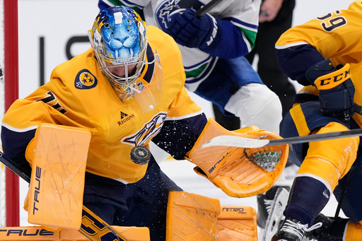 Nashville Predators goaltender Juuse Saros (74) blocks a shot on goal during the first period of an NHL hockey game against the Vancouver Canucks, Thursday, Oct. 23, 2025, in Nashville, Tenn. (AP Photo/George Walker IV) Nashville Predators goaltender Juuse Saros (74) blocks a shot on goal during the first period of an NHL hockey game against the Vancouver Canucks, Thursday, Oct. 23, 2025, in Nashville, Tenn. (AP Photo/George Walker IV)