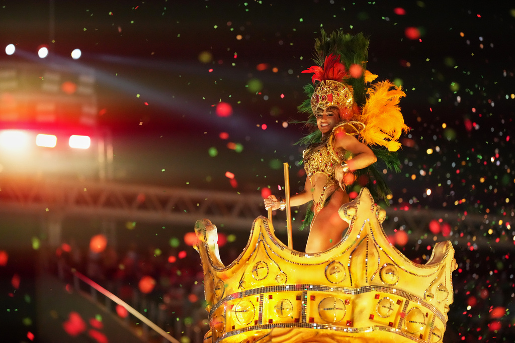 A performer from the Grande Rio samba school parades on a float during Carnival celebrations at the Sambadrome in Rio de Janeiro, Wednesday, Feb. 18, 2026. (AP Photo/Silvia Izquierdo)