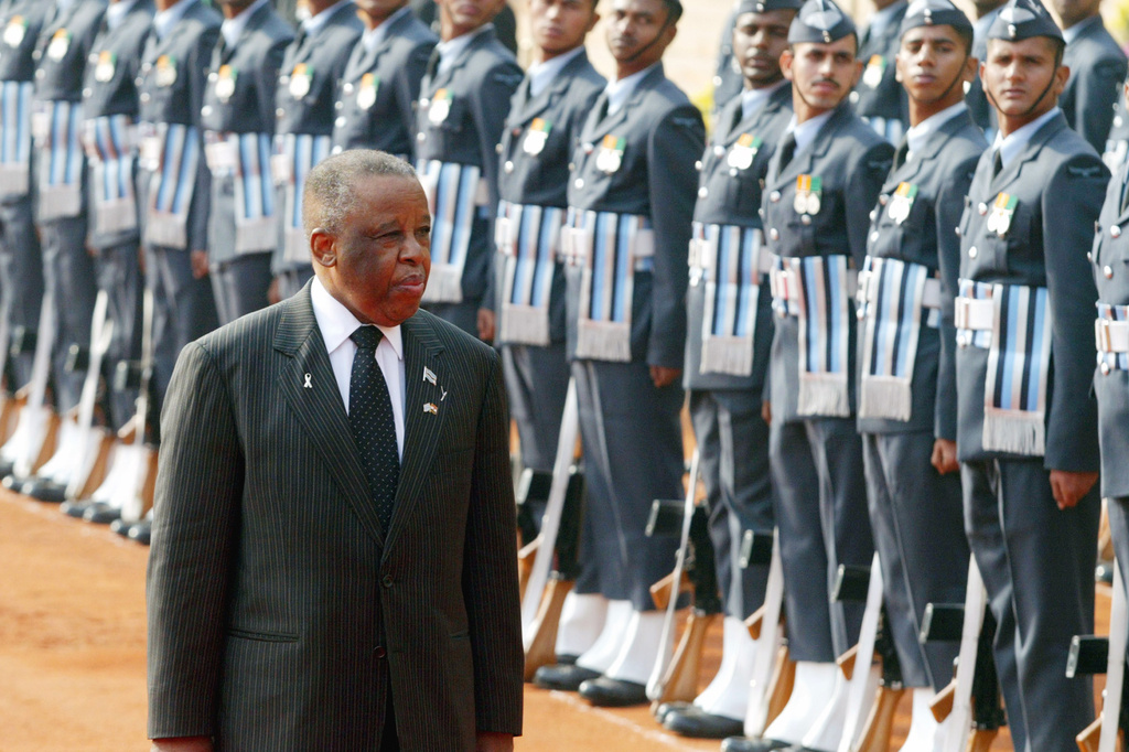 FILE - President of the Republic of Botswana Festus Mogae inspects the ceremonial guard of honor at the Rashtrapati Bhawan (Presidential Palace), in New Delhi, Dec. 8, 2006. (AP Photo/ Mustafa Quraishi, File)