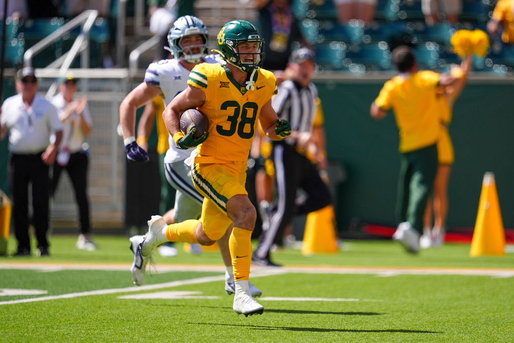Baylor safety Jacob Redding (38) runs towards the end zone as he returns an interception 66 yards for a touchdown during the second half of an NCAA college football game against Kansas State, Saturday, Oct. 4, 2025, in Waco, Texas. (AP Photo/Ronaldo Bolaños)