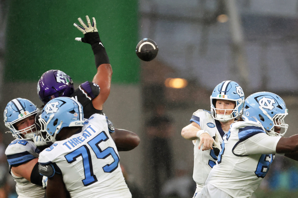 North Carolina's Billy Edwards Jr. throws a pass during an NCAA college football game against TCU in Dublin, Ireland, Saturday, Aug. 29, 2026. (AP Photo/Peter Morrison)