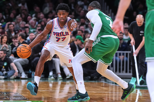 Philadelphia 76ers guard VJ Edgecombe (77) drives to the basket against Boston Celtics guard Jaylen Brown (7) during the second half of an NBA basketball game, Wednesday, Oct. 22, 2025, in Boston. (AP Photo/Charles Krupa) Philadelphia 76ers guard VJ Edgecombe (77) drives to the basket against Boston Celtics guard Jaylen Brown (7) during the second half of an NBA basketball game, Wednesday, Oct. 22, 2025, in Boston. (AP Photo/Charles Krupa)