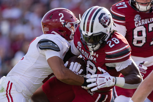 Alabama defensive back Zabien Brown (2) tackles South Carolina running back Matt Fuller (28) during the first half of an NCAA college football game, Saturday, Oct. 25, 2025, in Columbia, S.C. (AP Photo/Scott Kinser) Alabama defensive back Zabien Brown (2) tackles South Carolina running back Matt Fuller (28) during the first half of an NCAA college football game, Saturday, Oct. 25, 2025, in Columbia, S.C. (AP Photo/Scott Kinser)