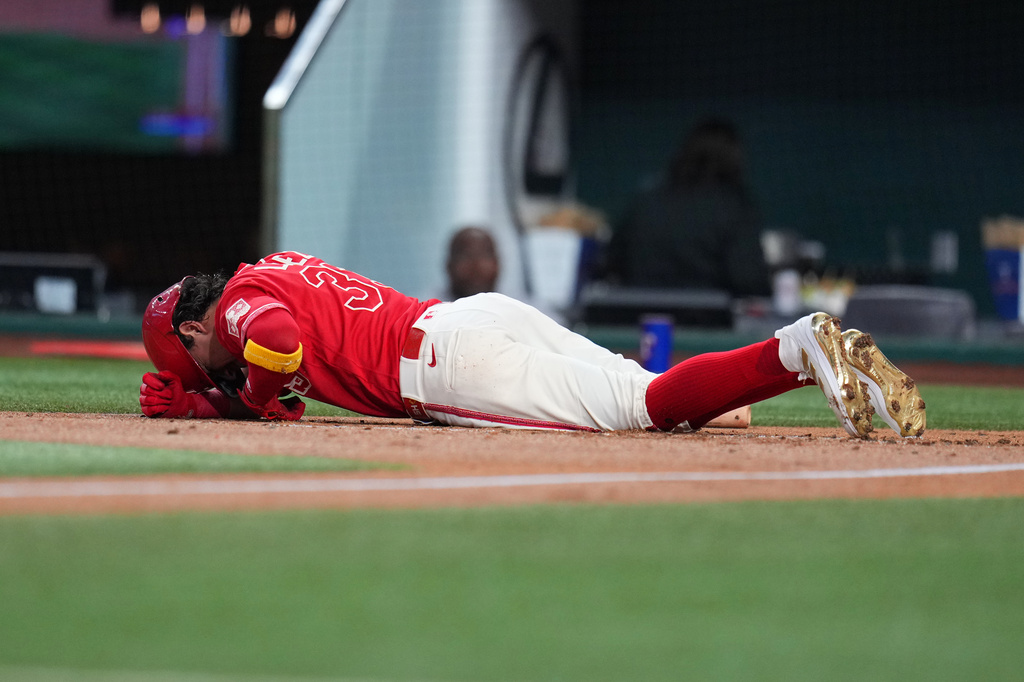 Texas Rangers' Nicky Lopez reacts after being hit by a pitch from Toronto Blue Jays starting pitcher José Soriano during the second inning of a baseball game Saturday, Sept. 19, 2026, in Arlington, Texas. (AP Photo/Julio Cortez)