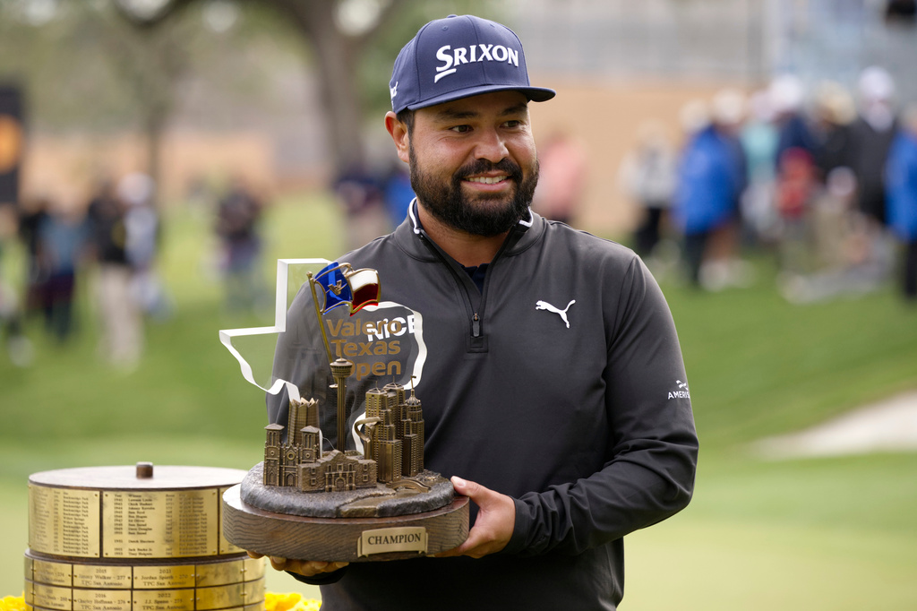 J.J. Spaun holds the championship trophy after winning the Valero Texas Open golf tournament in San Antonio, Sunday, April 5, 2026. (AP Photo/Darren Abate)
