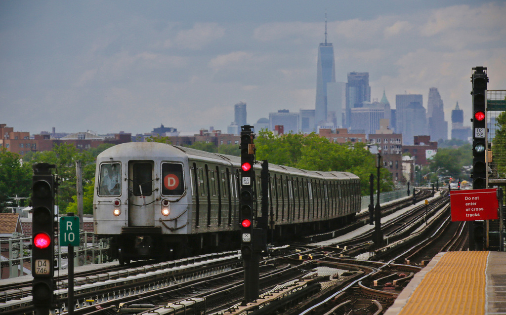FILE - A subway approaches an above ground station in the Brooklyn borough of New York with the New York City skyline in the background, June 21, 2017. (AP Photo/Bebeto Matthews, File)