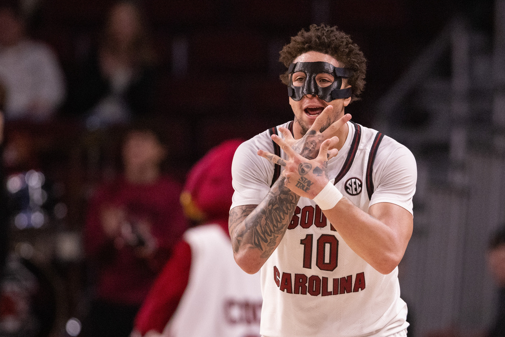South Carolina forward Myles Stute (10) celebrates after three point basket against the Vanderbilt in the first half of an NCAA college basketball game, Saturday, Jan. 3, 2026, in Columbia, N.C. (AP Photo/Scott Kinser)