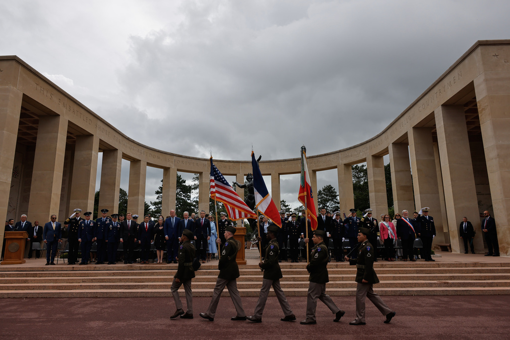 U.S. Defense Secretary Pete Hegseth, center left, attends a ceremony at the US cemetery to commemorate the 82nd anniversary of the D-Day landings, in Colleville-sur-Mer, Normandy, France, Saturday, June 6, 2026. (AP Photo/Jeremias Gonzalez)