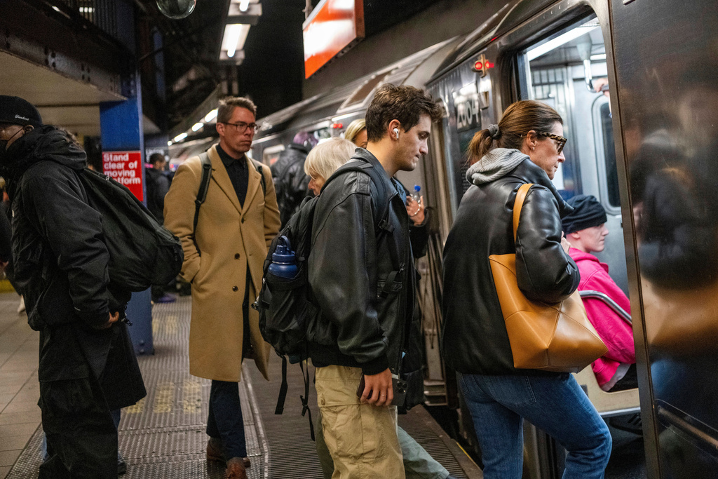 FILE - Commuters ride the subway in New York on April 5, 2024. (AP Photo/Brittainy Newman, File)