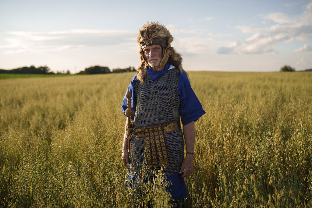 Andrei Tase poses for a portrait, wearing a Roman soldier outfit, in Poiana, Romania, Saturday, July 12, 2025, during the Getodava historical reenactment festival. (AP Photo/Vadim Ghirda)