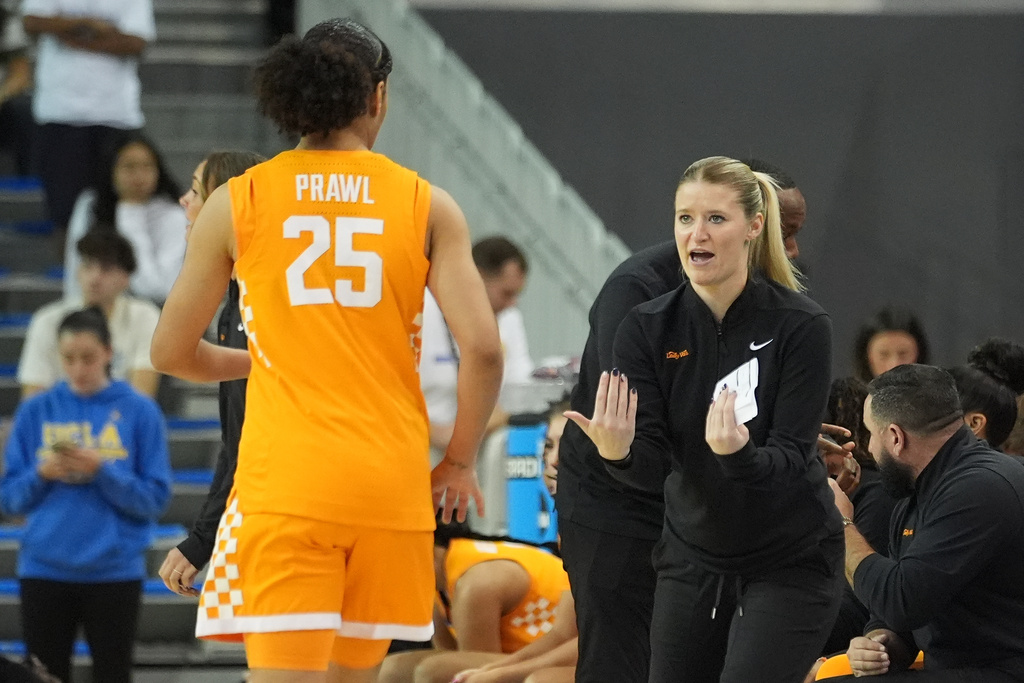 Tennessee guard Deniya Prawl gets instructions from Tennessee head coach Kim Caldwell during the first half of an NCAA college basketball game in Los Angeles, Sunday, Nov. 30, 2025. (AP Photo/Damian Dovarganes)