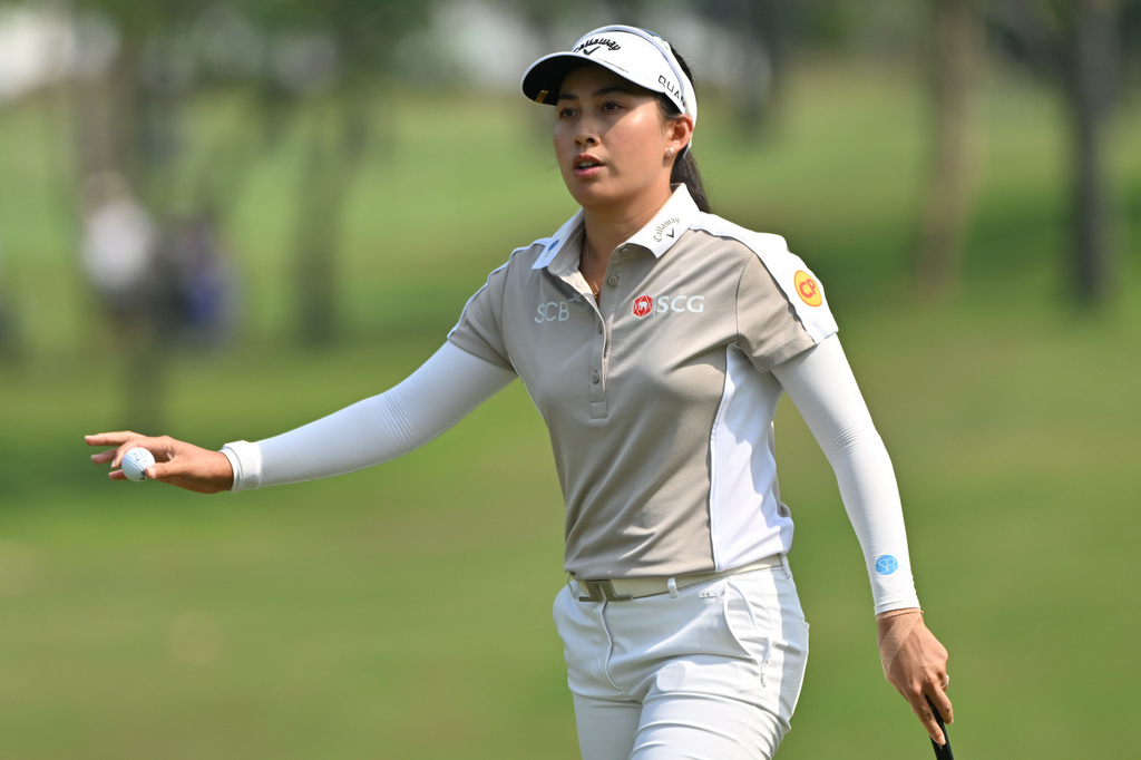 Jeeno Thitikul of Thailand reacts after putting on the first hole during the first round of the LPGA Honda Thailand golf tournament in Pattaya, Thailand, Thursday, Feb. 19, 2026. (AP Photo/Kittinun Rodsupan)