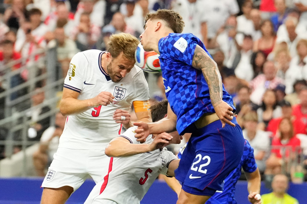 England's Harry Kane (9) heads the ball and scores a goal during the World Cup Group L soccer match between England and Croatia in Arlington, Texas, near Dallas, Wednesday, June 17, 2026. (AP Photo/Tony Gutierrez)