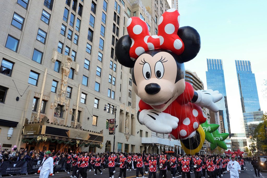 Disney's Minnie Mouse balloon floats down Central Park South during the Macy's Thanksgiving Day Parade, Thursday, Nov. 27, 2025, in New York. (AP Photo/Frank Franklin II)