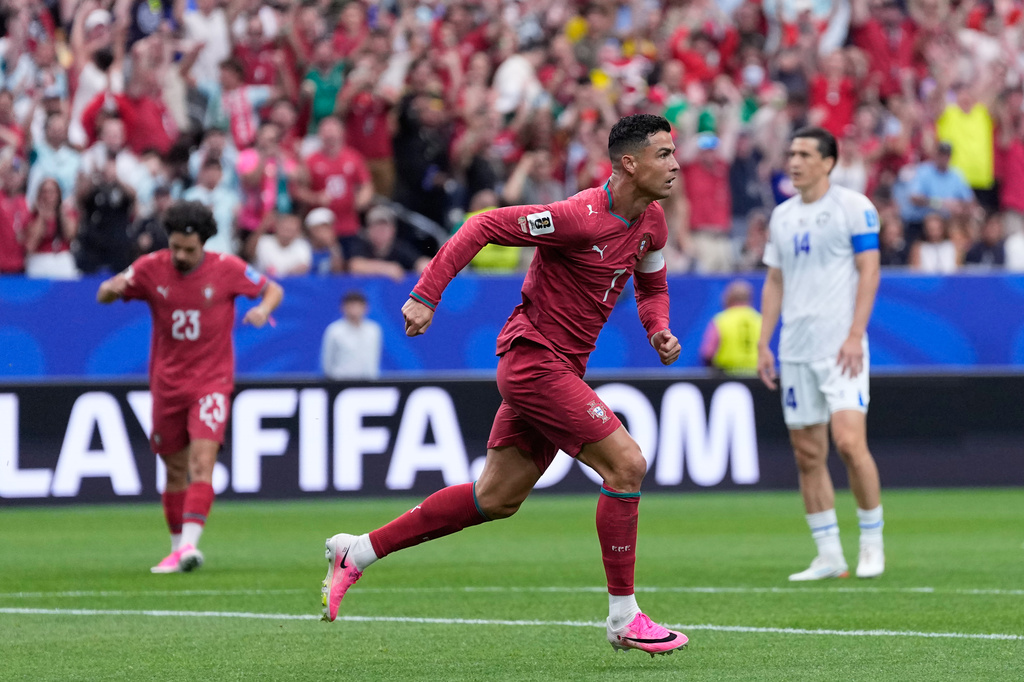 Portugal's Cristiano Ronaldo celebrates after scoring the opening goal during the World Cup Group K soccer match between Portugal and Uzbekistan in Houston, Tuesday, June 23, 2026. (AP Photo/Ashley Landis)