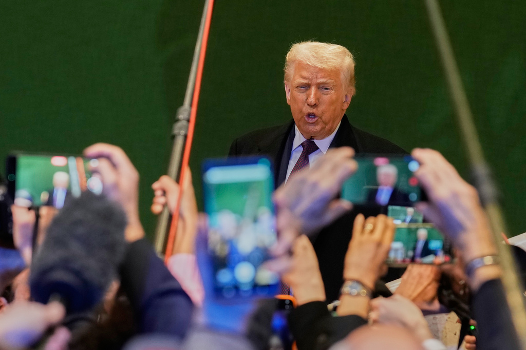 US President Donald Trump talks to media during the Annual Meeting of the World Economic Forum in Davos, Switzerland, Thursday, Jan. 22, 2026. (AP Photo/Markus Schreiber)
